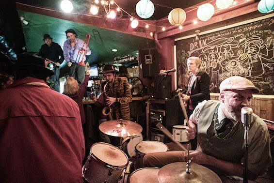 Full band playing a packed room